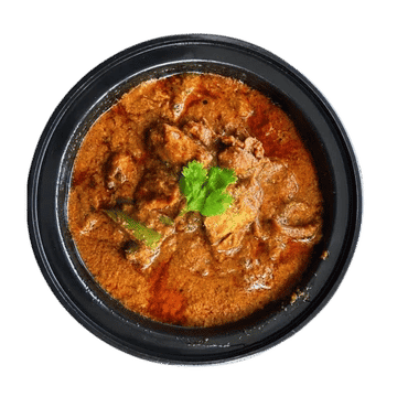 Indian chicken curry in rich spiced gravy garnished with fresh coriander and green chili